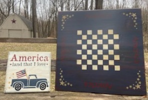 Stenciled flag checkerboard and America land that I love sign