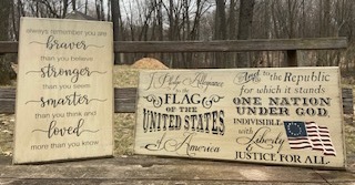 two wooden stenciled patriotic signs