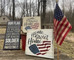 Three wooden stenciled patriotic signs