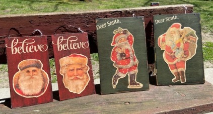 Paper Santas on red and green boards