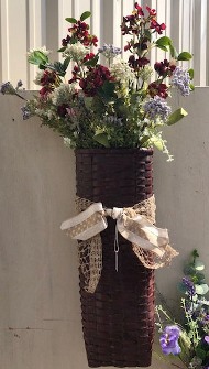 24" tall skinny basket with flowers and beige ribbon