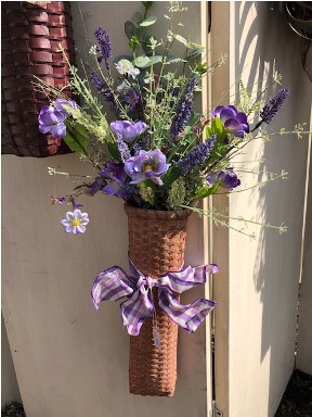 Tall skinny basket of lavendar flowers