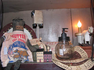 primitive doll and lotion dispenser