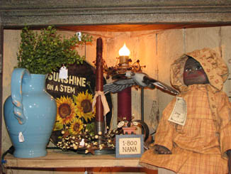 Blue pitcher and primitive dolll